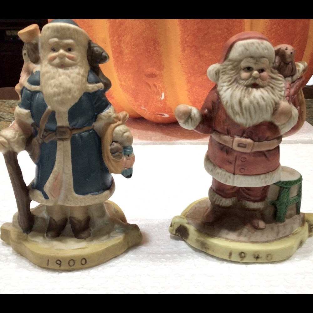 Vintage 2 porcelain figures of Santa thru the yrs